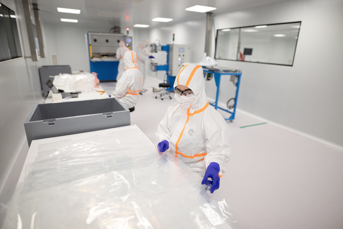 Cleanroom operator in protective suit